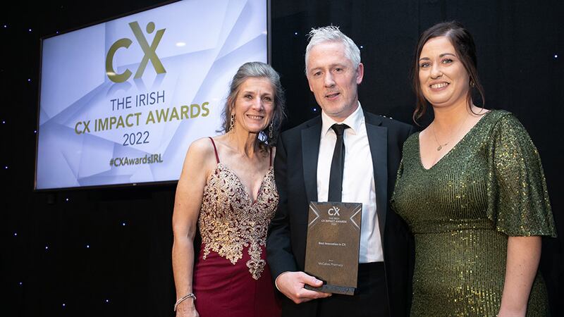 Jan Richards, awards judge, presents the Best Innovation CX award to Sean Gleeson & Marina Timotijevic, McCabes Pharmacy.