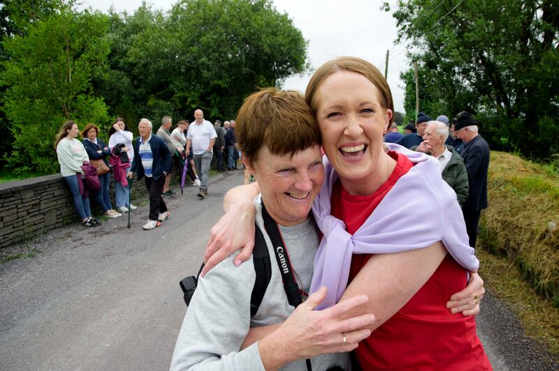 Former champion road bowlers Gretta Cormican and Geraldine Daly watch the Junior B Munster Road Bowling final at Castletownkinneigh, west Cork. Photograph: Daragh Mc Sweeney/Provision