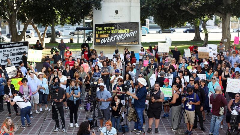 Demonstrators listen to a speaker during a Families Belong Together rally in Los Angeles, California, US. Photograph: Dania Maxwell/Bloomberg