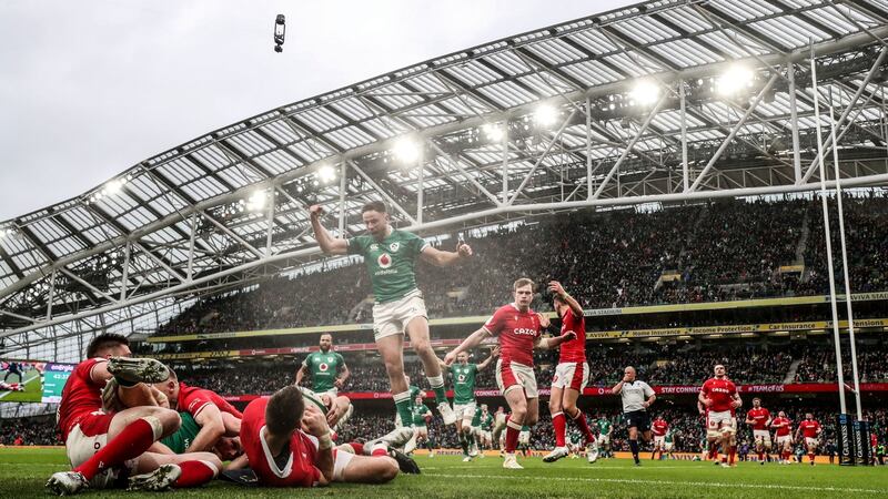 Hugo Keenan celebrates as Andrew Conway scores Ireland’s second try. Photograph: Dan Sheridan/Inpho