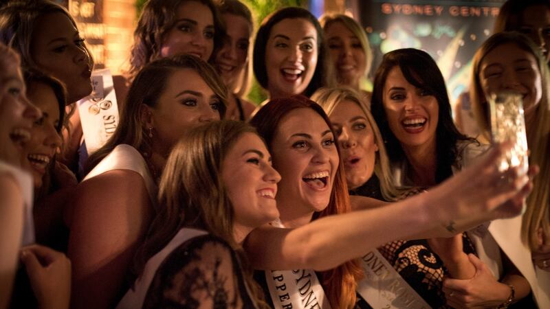 Brianna Parkins (centre, holding phone): 'I still Skype a few of the Roses regularly and we WhatsApp every day.' Photograph: Perry Duffin