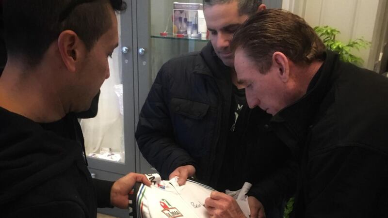 Seán Kelly signs a PDM cycling jersey for Italian fans at the Rose Hotel in Tralee