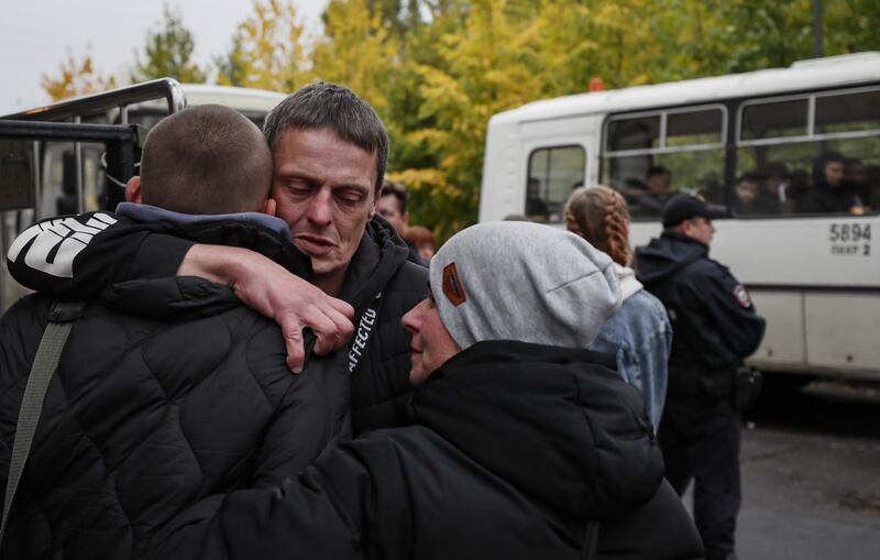 Russian conscripted men say goodbye to relatives at a recruiting office during Russia's partial military mobilization in Moscow. Photograph: Yuri Kochetkov/EPA