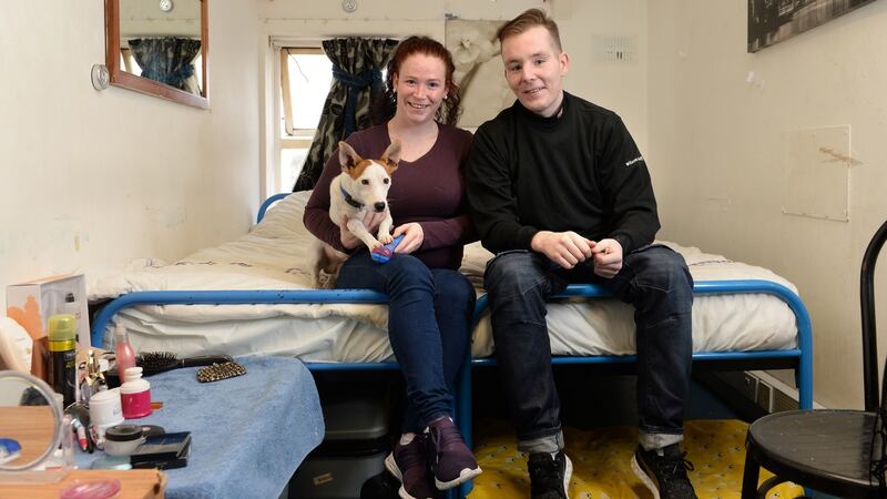 Mary and Paulie with their dog Scooter, at their accommodation. Photograph: Dara Mac Dónaill/The Irish Times