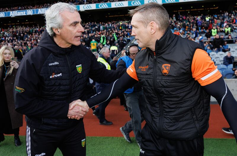 Donegal’s manager Jim McGuinness and manager Kieran McGeeney of Armagh after the game. Photograph: James Crombie/Inpho