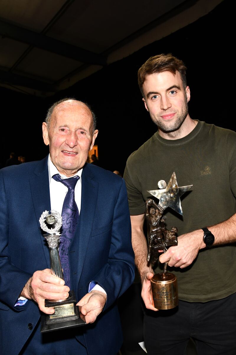 Sixty years apart: Noel Tierney, Footballer of the Year 1964, and Paul Conroy, Footballer of the Year 2024 at the recent celebration to mark the legendary sporting career of the late Milltown and Galway hero Tierney in Milltown Community Centre. Photograph: Jacinta Fahy