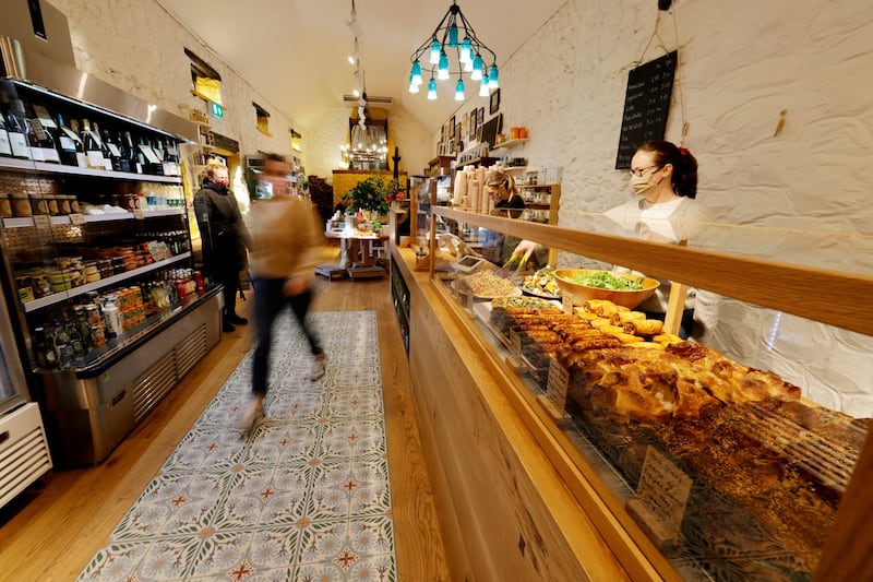 Staff working at  Roundwood Stores. Photograph: Alan Betson