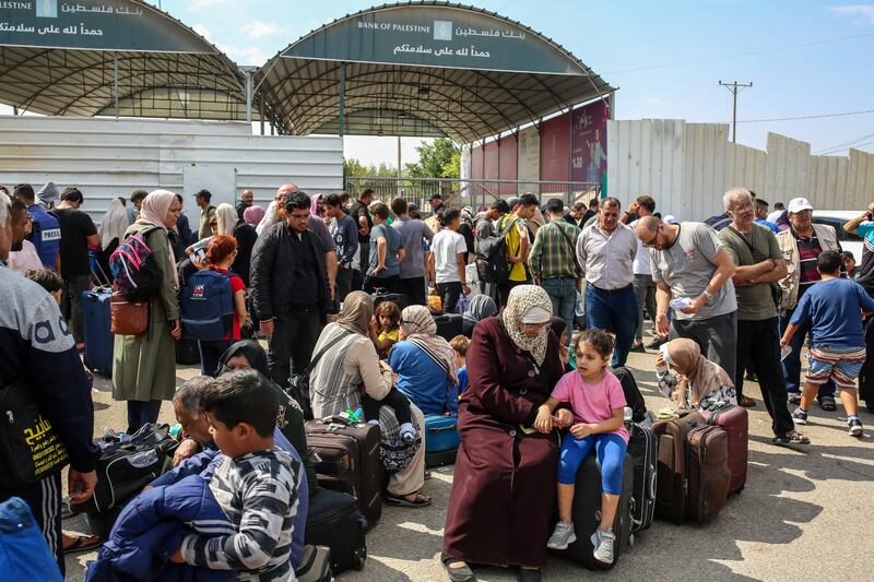 People gather on the Gaza side of the Rafah border crossing with Egypt during the early days of the war in Gaza in October. Egypt is the keeper of Gaza’s only gateway to the outside world. Photograph: Samar Abu Elouf/The New York Times