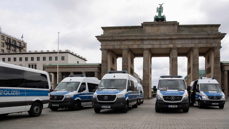 Police cars are seen in front of the Brandenburg Gate during anti-lockdown protests in Berlin, Germany, on August 1st. Photograph: Paul Zinken/AFP/ via Getty Images