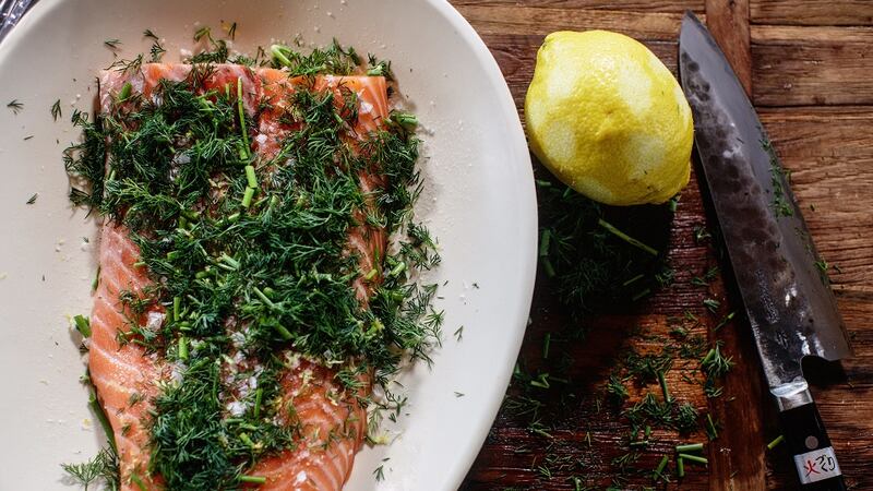 The salmon will cure - or cook - in the salt, sugar and dill marinade