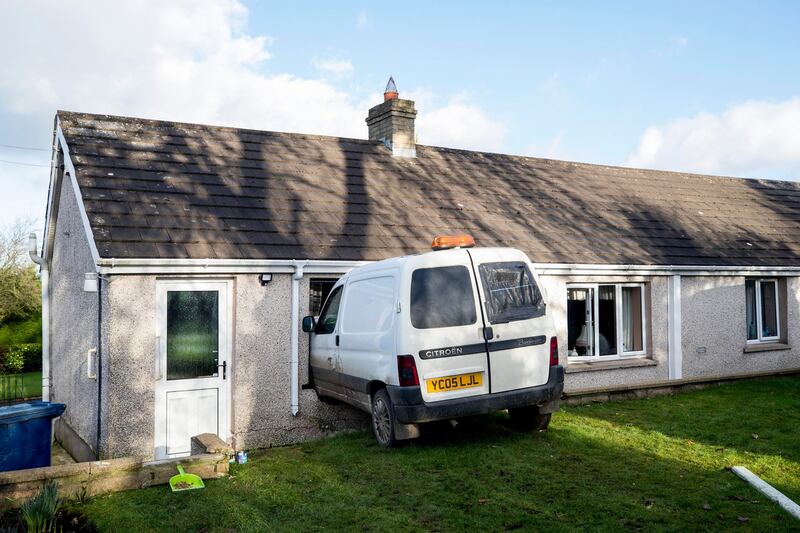 The scene where a van has crashed through the kitchen window of pensioner Annie Burrell’s home outside Waringstown, in County Down. Photograph: Liam McBurney/PA Wire