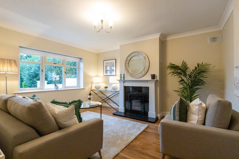 The livingroom has a solid-fuel stove in a sandstone fireplace.