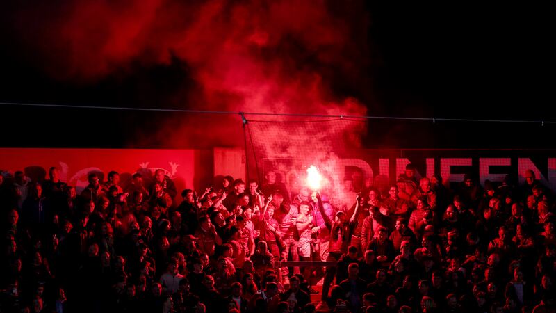 Munster rugby fans setting off flares during a game against Crusaders  in Pairc Ui Chaoimh, Cork, in March 2024. Photograph: Ben Brady/Inpho