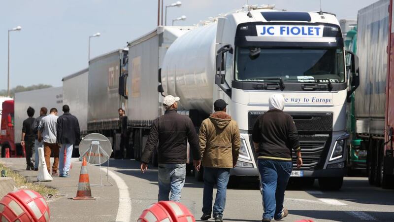 A file image from June this year showing  migrants on the main road into Calais ferry port. Photograph: PA