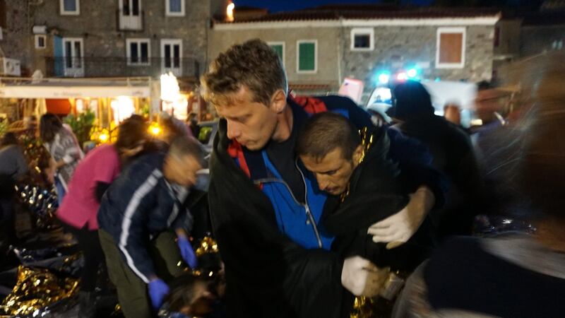Migrants arrive at the port of Mytilini, Lesbos island, Greece.  Photograph: Stratis Balaskas/EPA