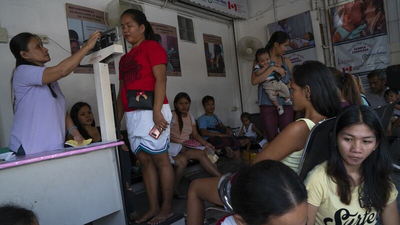 The waiting area of Likhaan clinic in Tondo, Manila. Likhaan is a nonprofit nongovernment organisation providing free consultation and family planning methods such as implants and IUD to women especially in marginalised communities. Photograph: Kimberly dela Cruz