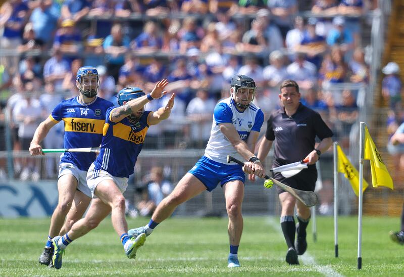 Tipperary's Willie Connors looks to block Darragh Lyons of Waterford during the game in Thurles. Photograph: Bryan Keane/Inpho