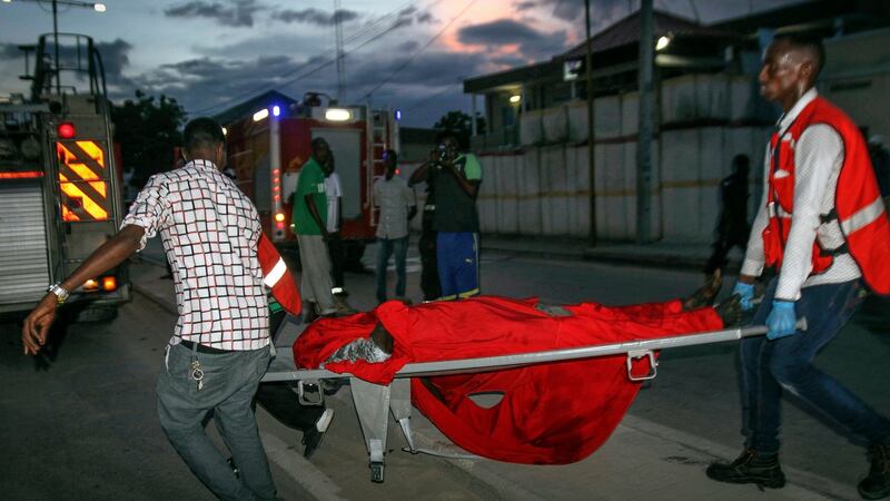 A victim of the attack is carried on a stretcher from the scene. Photograph: EPA