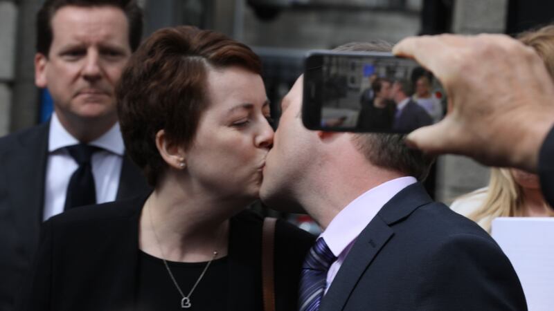 Ruth Morrissey and her husband, Paul share a kiss outside the Four Courts after a High Court judgement in 2019.  Photograph: Collins Courts