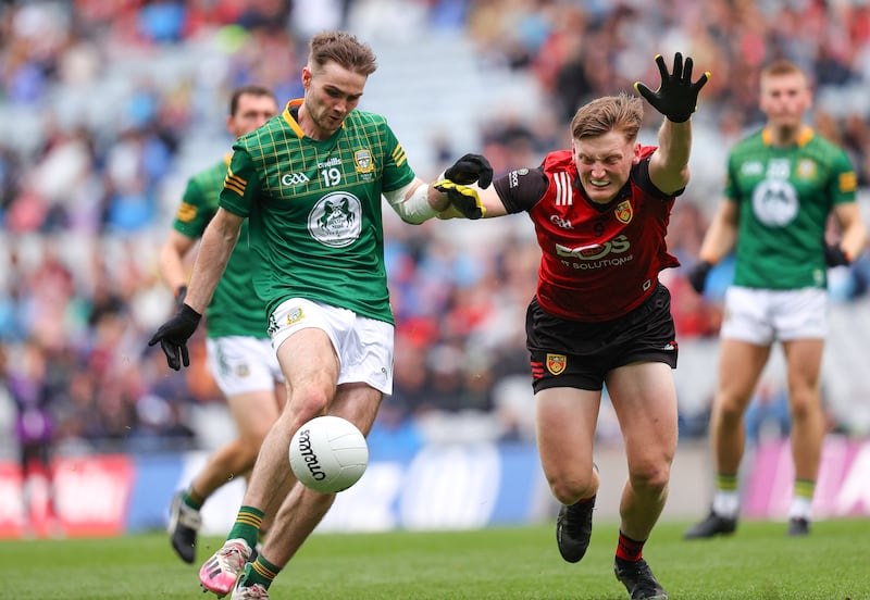 Meath's Cathal Hickey and Odhran Murdock of Down. Burren’s Odhrán Murdock makes the trip to Down from Australia  where he has been checking out AFL clubs. Photograph: Bryan Keane/Inpho
