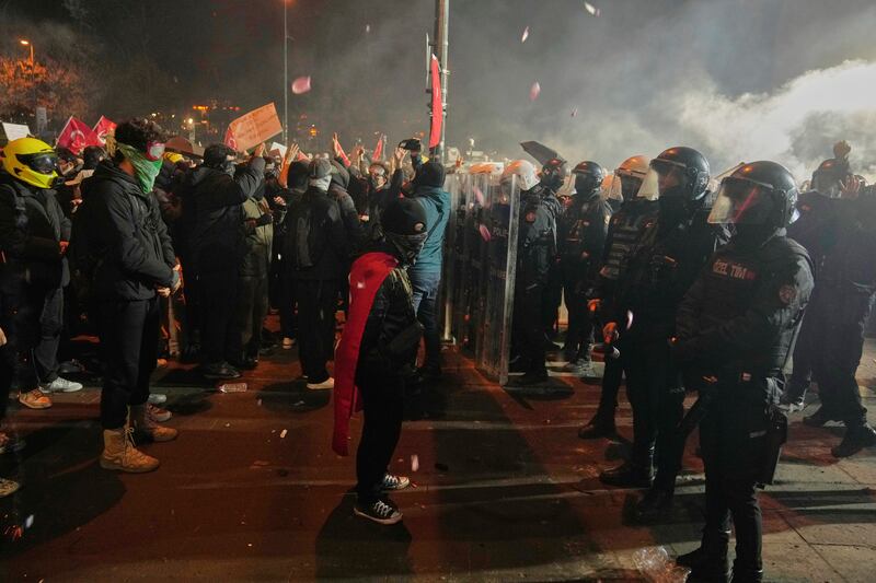 Protesters face off against anti-riot police in Istanbul. Photograph: Khalil Hamra/AP