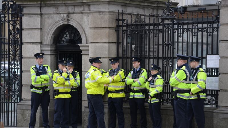 Gardaí outside Leinster House ahead of a bus protest. Photograph: Dara Mac Donaill