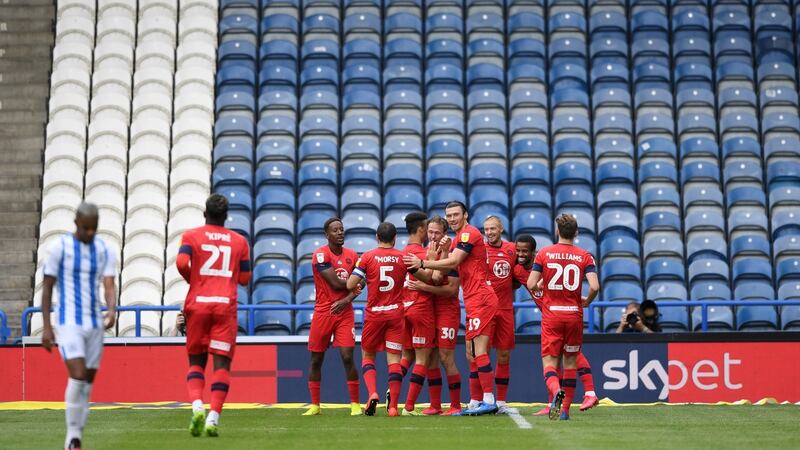 Anthony Pilkington after his goal for Wigan against Huddersfield Town. Photograph: Getty Images