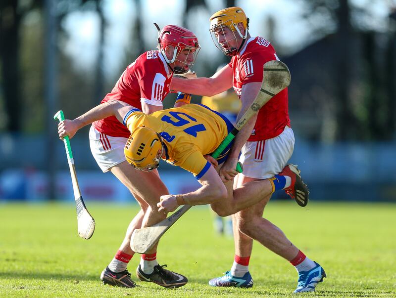 Clare’s Robin Mounsey tries to get past Cork’s Conor O’Callaghan and Sean Twomey during a 2024 Munster Senior Hurling League clash at Páirc Uí Rinn, Co Cork. Photograph: Ken Sutton/Inpho