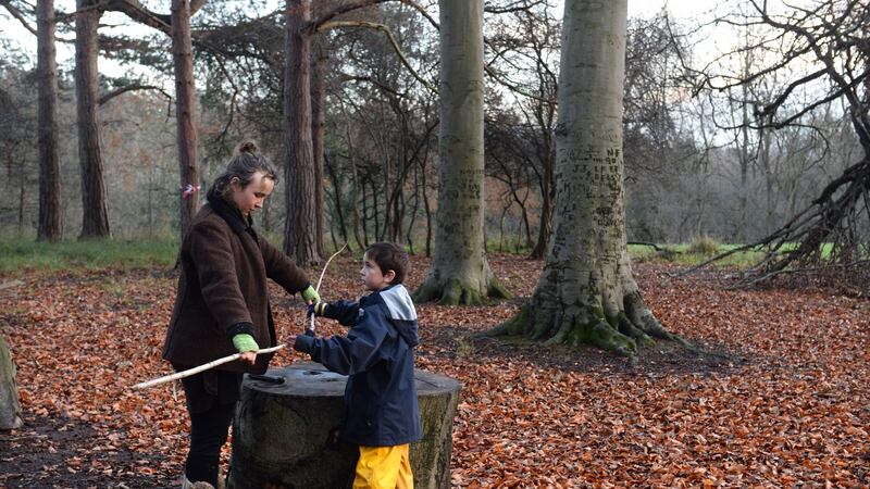 Lucy O’Hagan, forest school leader, with Samuel. Photograph: Dara Mac Dónaill / The Irish Times