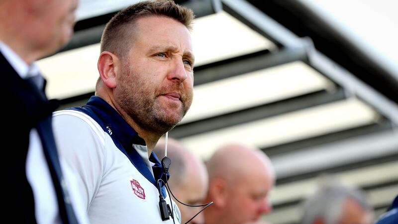 Kildare manager Cian O’Neill in the dug out for the second half after being sent off in the first half at St Conleth’s Park in Newbridge. Photograph: Ryan Byrne/Inpho