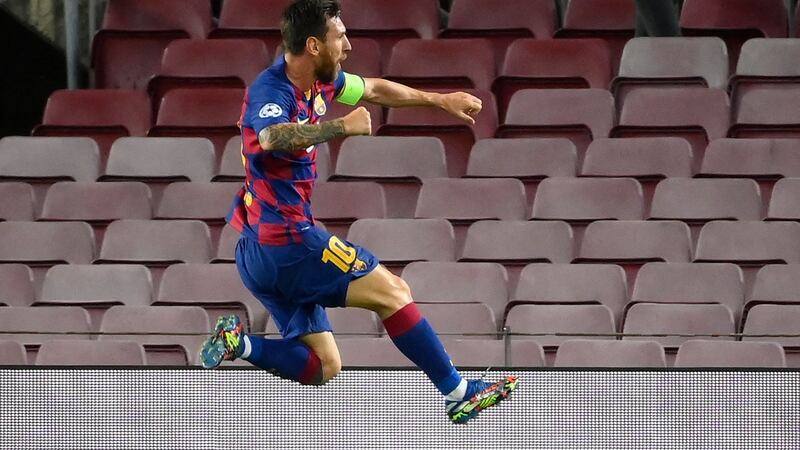 Lionel Messi celebrates scoring during Barcelona’s win over Napoli. Photograph: Lluis Gene/Getty/AFP