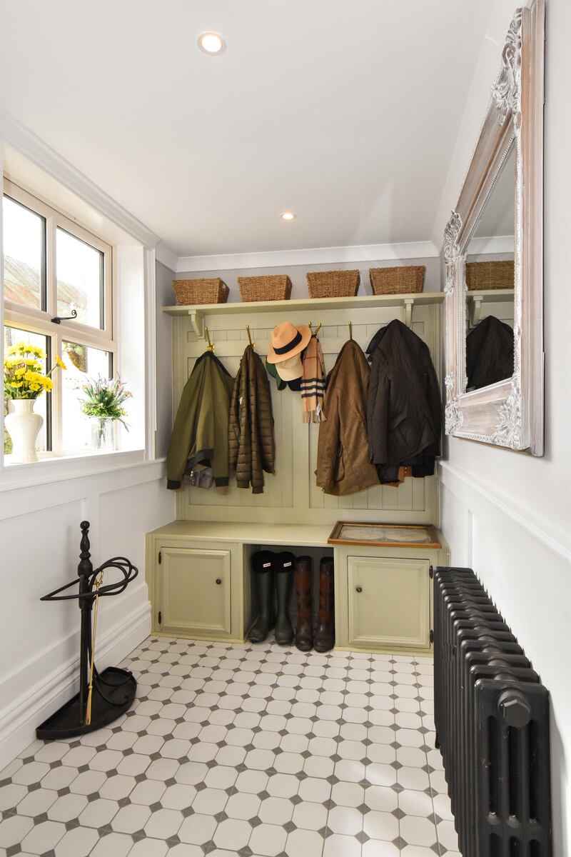 A bootroom lies at the end of the main hallway