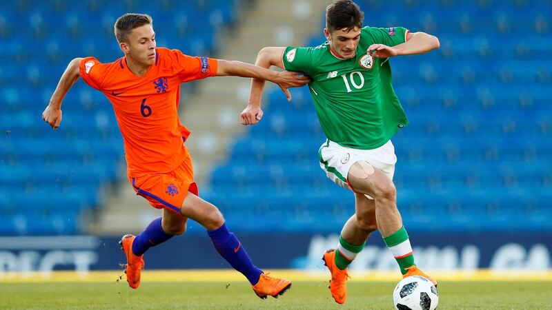 Troy Parrott  goes past  Bram Franken of the Netherlands during Monday’s European Under-17 Championship quarter-final. Photograph:  Jason Cairnduff/Reuters
