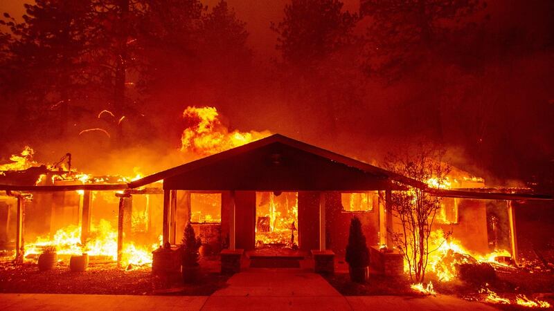 A home burns  in Paradise, California on November 8th, 2018: its 26,000 residents were told to flee. Photograph: Josh Edelson/AFP/Getty