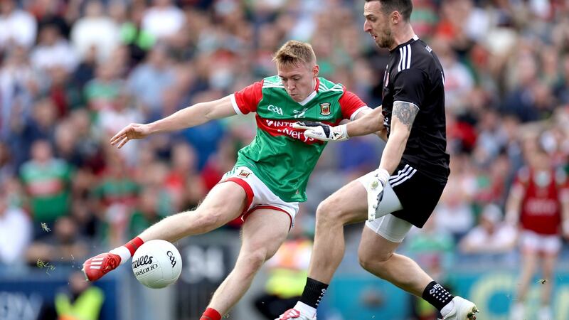 Bryan Walsh has his shot saved by goalkeeper Niall Morgan. Photo: James Crombie/Inpho