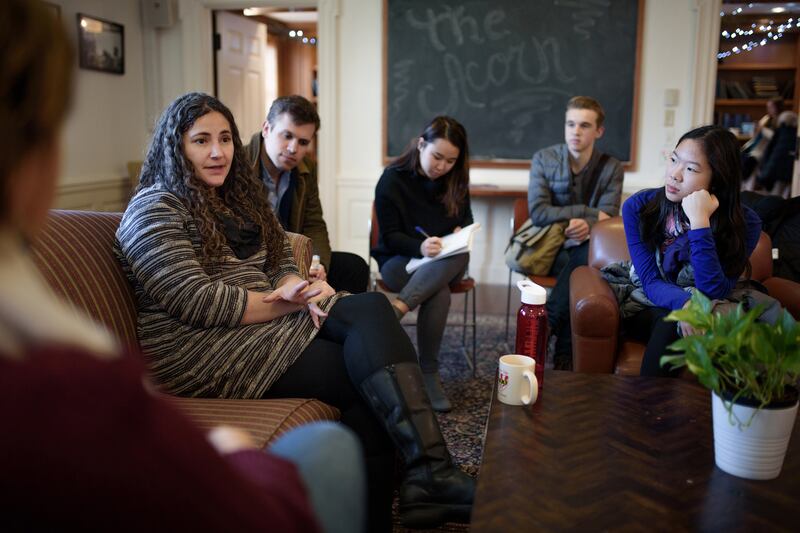Laurie Santos (left) talks with students after a session of her class at Yale University in New Haven, Connecticut on January  25th, 2018. Photograph: Monica Jorge/The New York Times