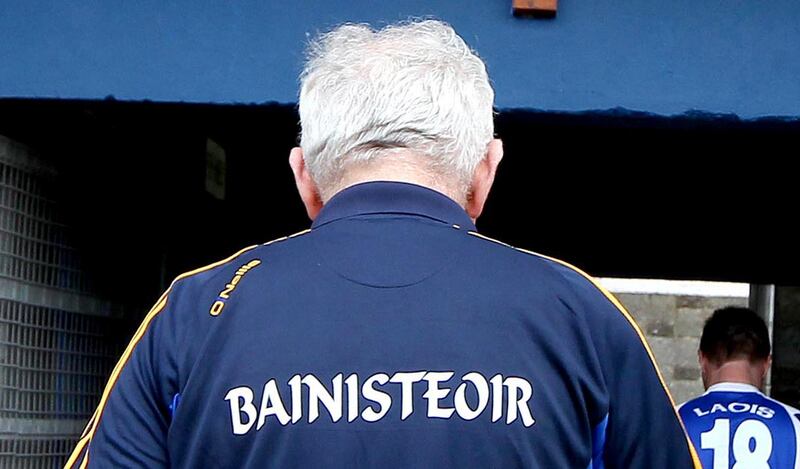 July 2013: Mick O'Dwyer leaves the pitch for the last time as Clare manager. He stepped down after the game against Laois. Photograph: Ryan Byrne/Inpho