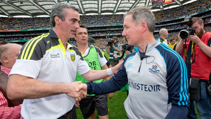 Donegal manager Jim McGuinness shakes hands with Dublin manager Jim Gavin after the game. Photograph: Morgan Treacy/Inpho