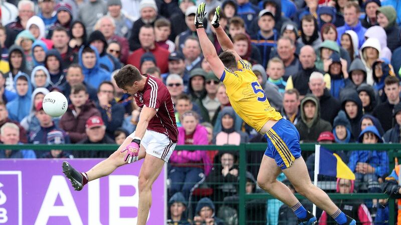 Roscommon’s John McManus can’t stop Shane Walsh scoring his second point. Photograph: Tommy Dickson/Inpho
