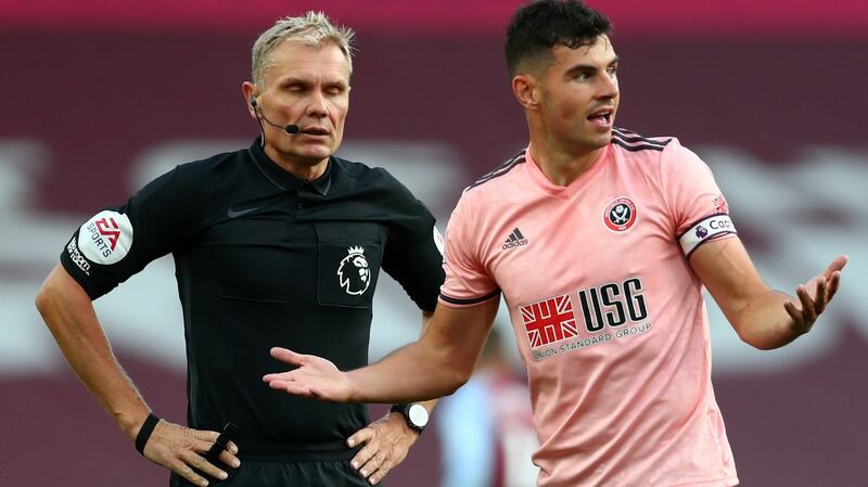 Sheffield United’s John Egan was sent off during his side’s defeat to Aston Villa. Photograph: Clive Rose/PA