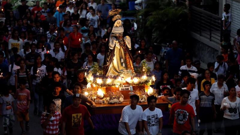 Devotees take part in a Good Friday procession in Mogpog, Marinduque, central Philippines. Photograph: Erik De Castro/Reuters