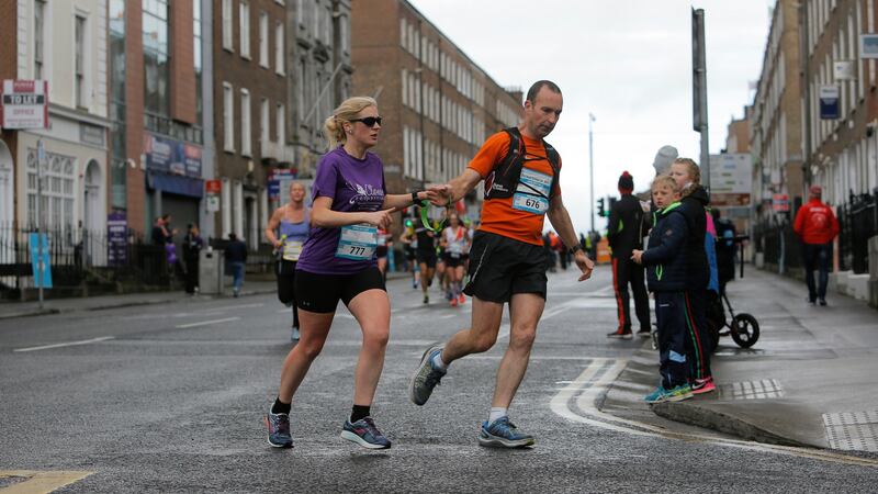 Visually impaired athlete Sinead Kane and John O’Regan take part in the Bon Secours Hospital Great Limerick Run. Photograph:  Brian Gavin Press 22