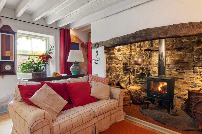 Sittingroom in the main house with inglenook fireplace