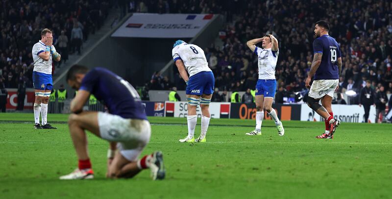 Italy players show their dismay after missing a chance to claim a famous victory in France. Photograph: Photograph: David Rogers/Getty Images