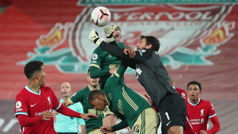 Liverpool goalkeeper Alisson  punches the ball clear during the  Premier League  match against Sheffield United at Anfield. Photograph: Photograph: Peter Byrne/AFP via Getty Images