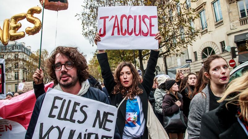 Rights activist Christelle Delarue (centre) holds a poster reading “I accuse” during a rally against femicide  in Paris, France, on Saturday. Photograph: Christophe Petit Tesson/EPA