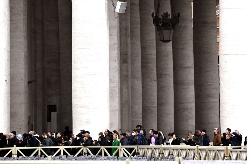 People wait in line to enter St Peter's Basilica for paying their respect to Emeritus Pope Benedict XVI in the Vatican. Photograph: Tiziana Fabi/AFP/Getty Images