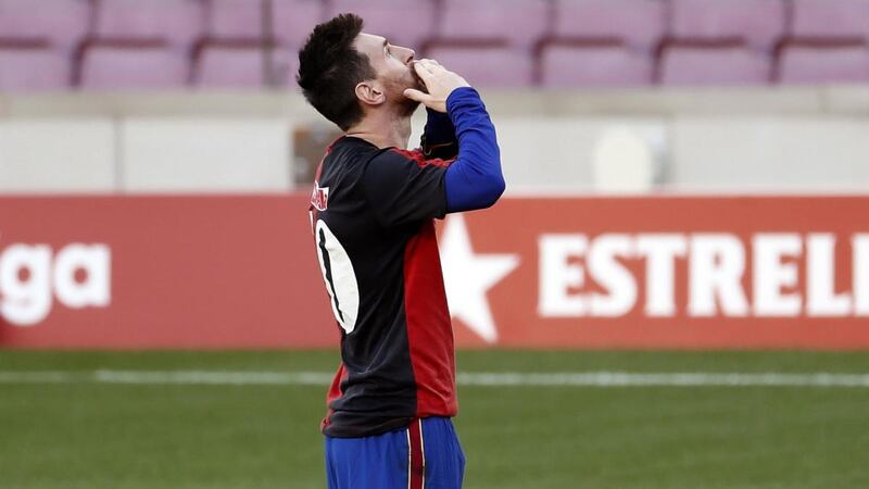 Barcelona’s Lionel Messi wears a Newell’s Old Boys jersey in memory of late Argentinian soccer legend Diego Maradona as he celebrates after scoring against Osasuna at Camp Nou in Barcelona on Sunday. Photograph: Andreu Dalmau/EPA