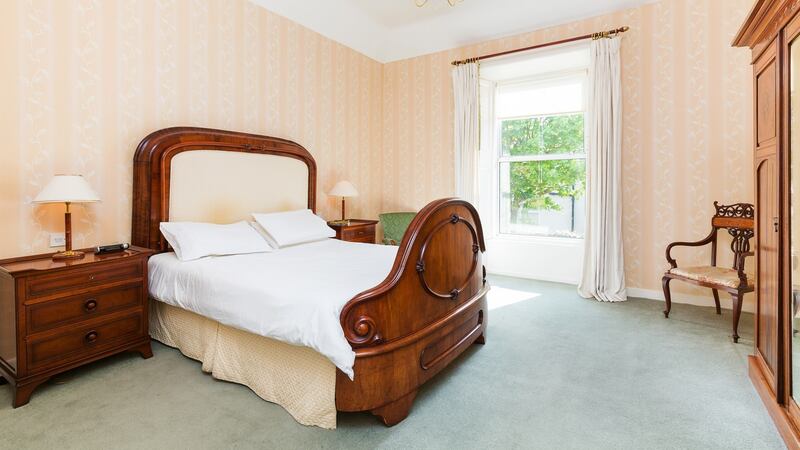 The huge main bedroom is on the return at the top of the stairs next to the family bathroom.