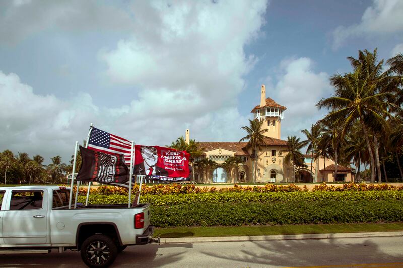 A truck displaying pro-Trump flags is dirven past Mar-a-Lago in Palm Beach, the home of former president Donald Trump, on August 9th one day after FBI agents searched the residence. Photograph: Saul Martinez/The New York Times